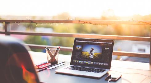 Laptop on a desk with a view